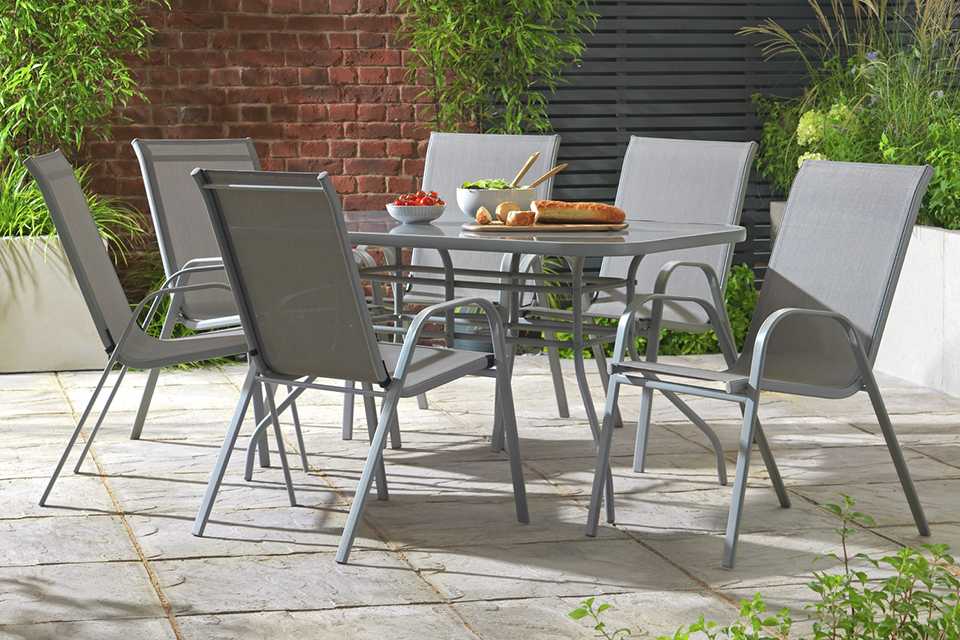 A grey metal patio set with 6 chairs.