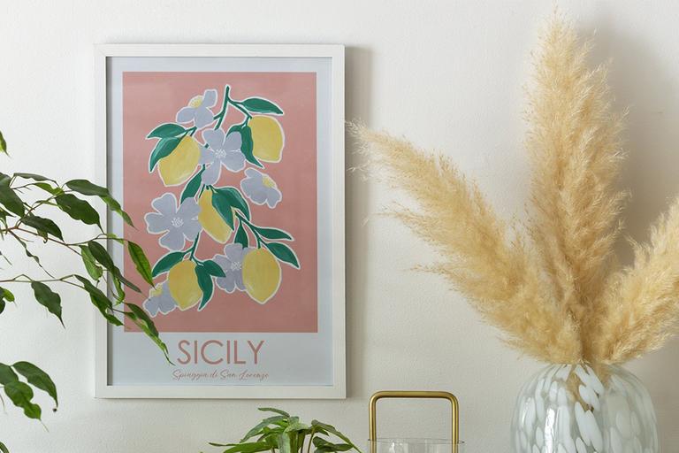 A Habitat fresh vintage Sicily wall art and a vase with dried pampas grass. 