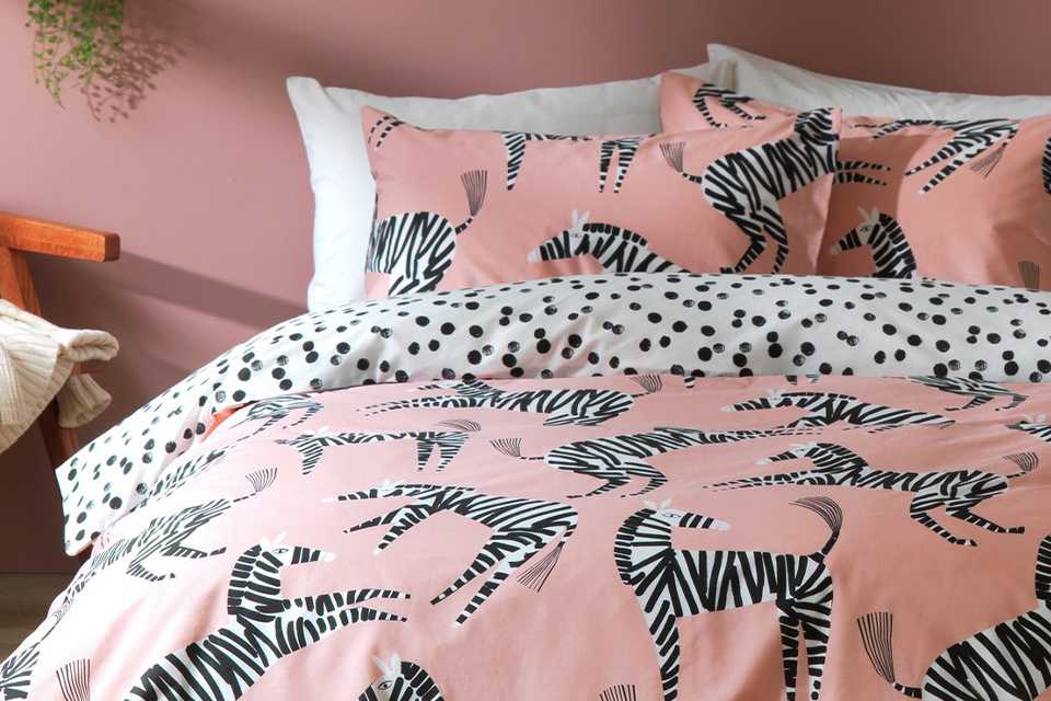 Pink zebra patterned bedding.