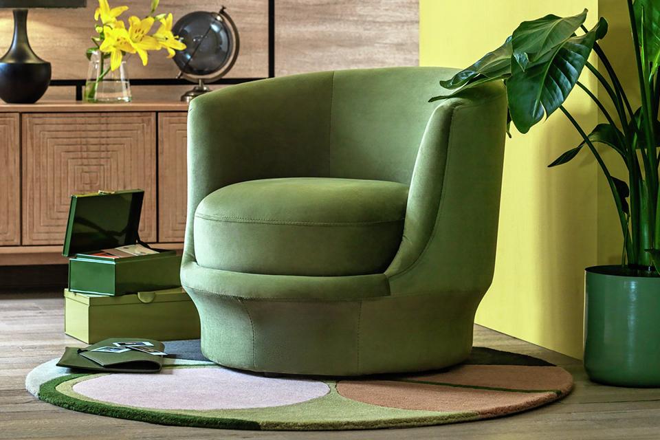 A Habitat olive-green Ronda chair in a living room.