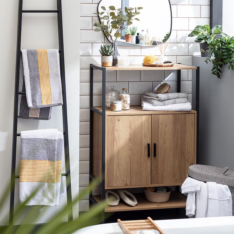 An under sink storage unit with black frame and wooden finish cabinet.