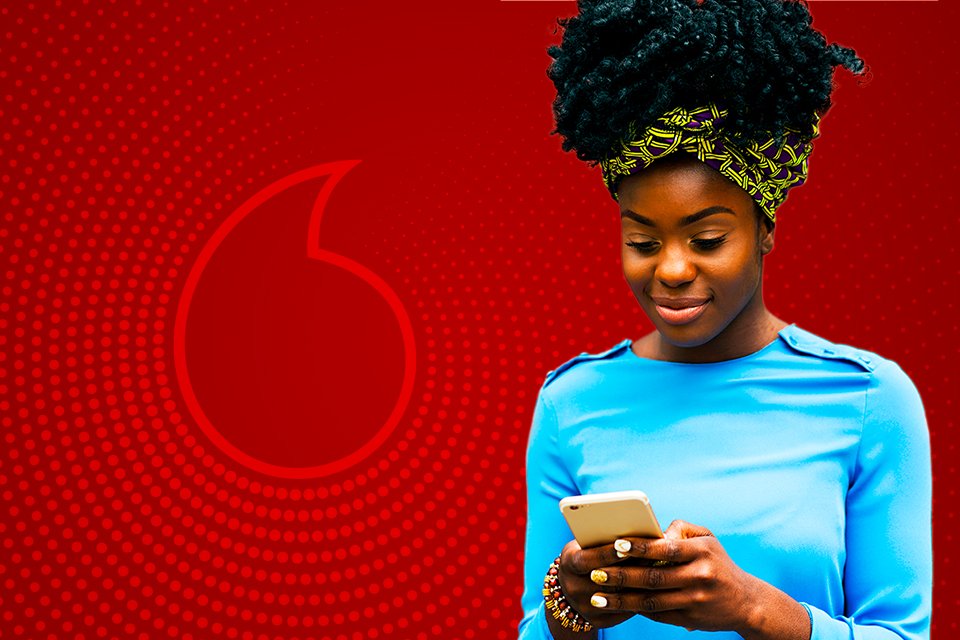 A girl looking into her Vodafone phone screen.