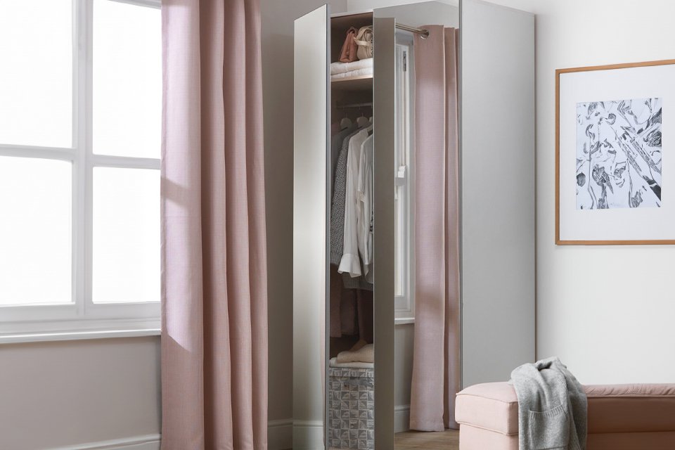 Mirrored wardrobe in bedroom.