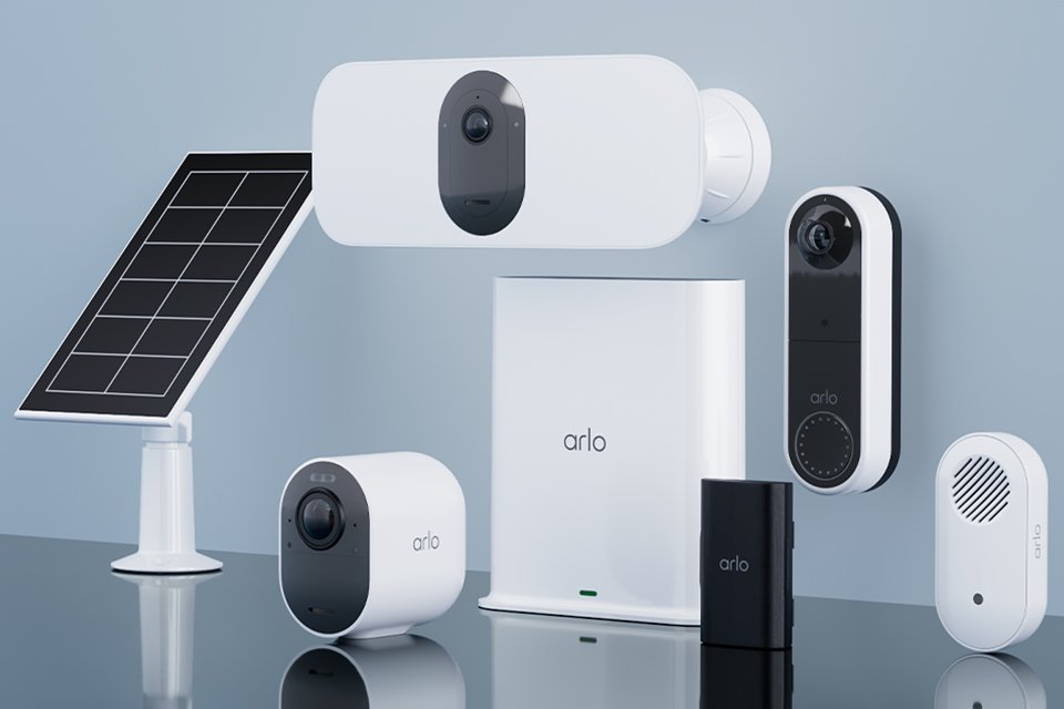 An assortment of Arlo home security products against a grey background. 