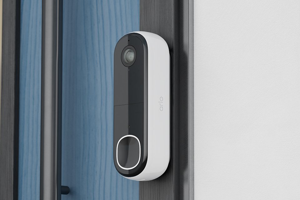 Arlo Essential HD Wi-Fi 4-in-1 smart video doorbell installed at the side of a door.