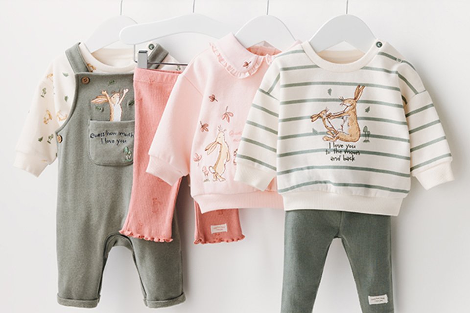 Character themed baby clothing including T-shirts, bottoms, and a dungaree set.