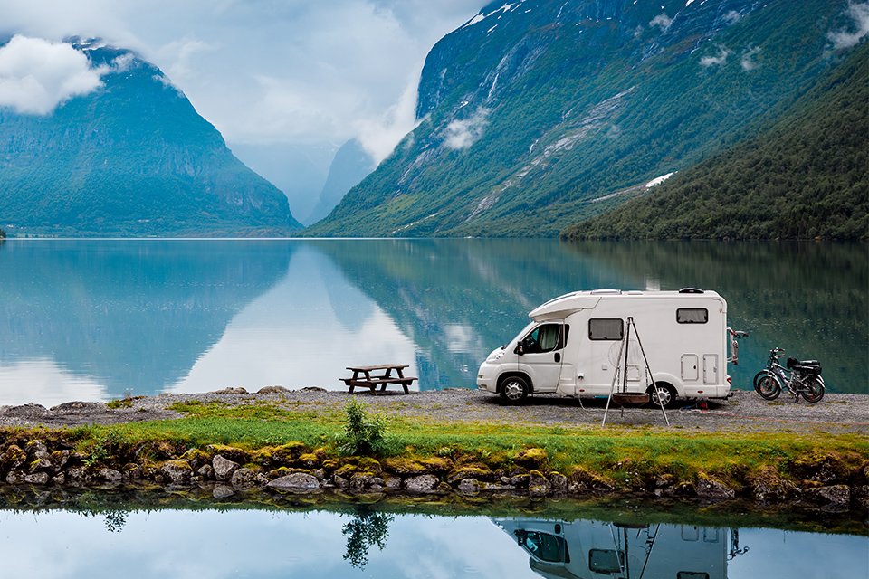campervan in a mountain and lake setting