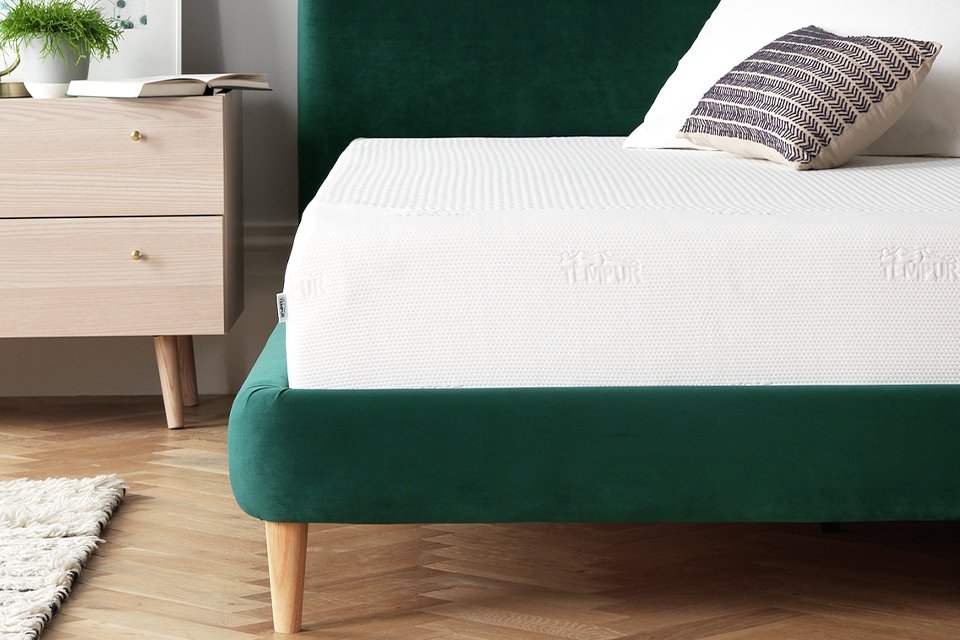 Green velvet bed with tempur mattress.