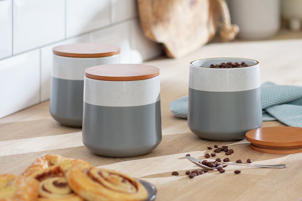 Habitat Speckle 3 piece storage canister on a wooden counter. 