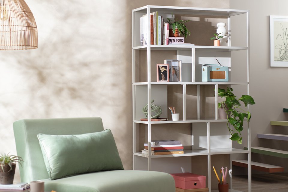 A light grey wide metal bookcase.