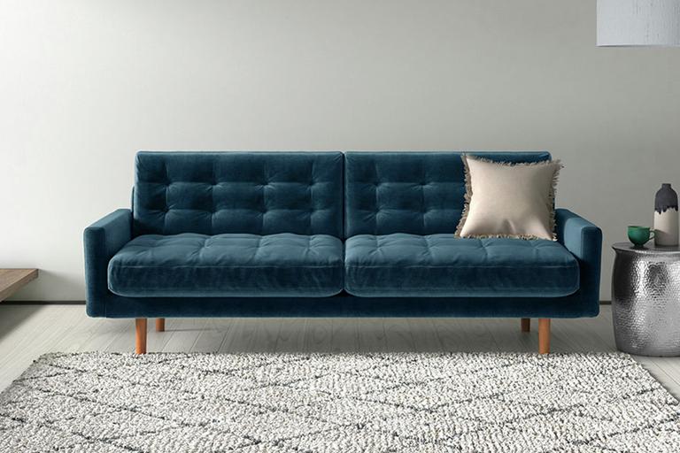 A pin-tucked velvet sofa.