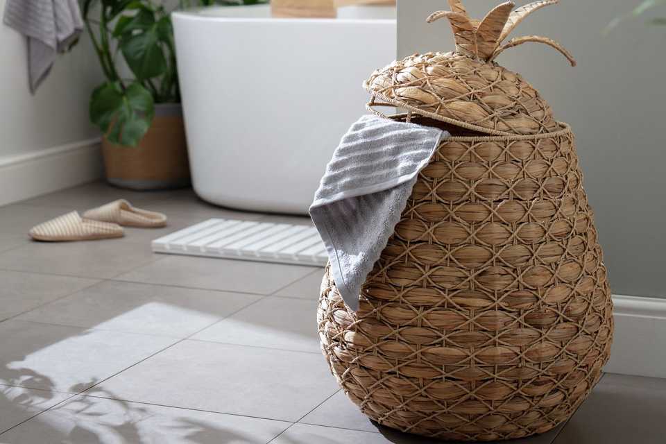 Image of a pineapple-shaped seagrass laundry basket.
