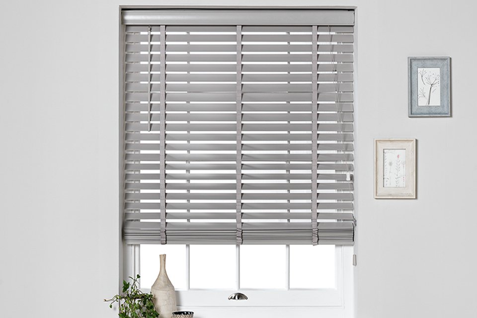 A window fitted with a grey Habitat wooden 50mm slat venetian blind.