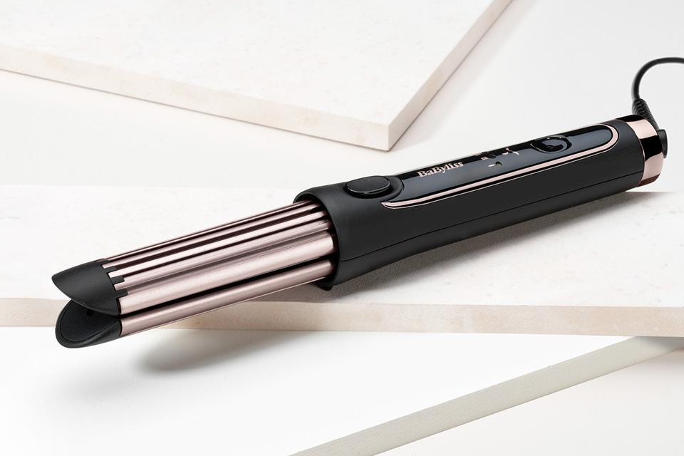 The BaByliss Curl Styler Luxe on a shiny surface.