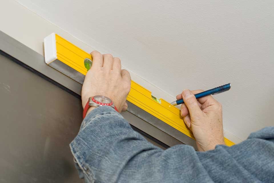 Spirit or laser level. Make sure your pole is straight.