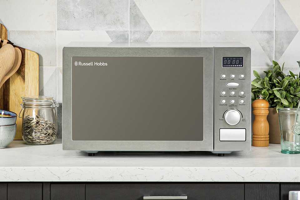 A Russell Hobbs 900W combination microwave on a marble counter.