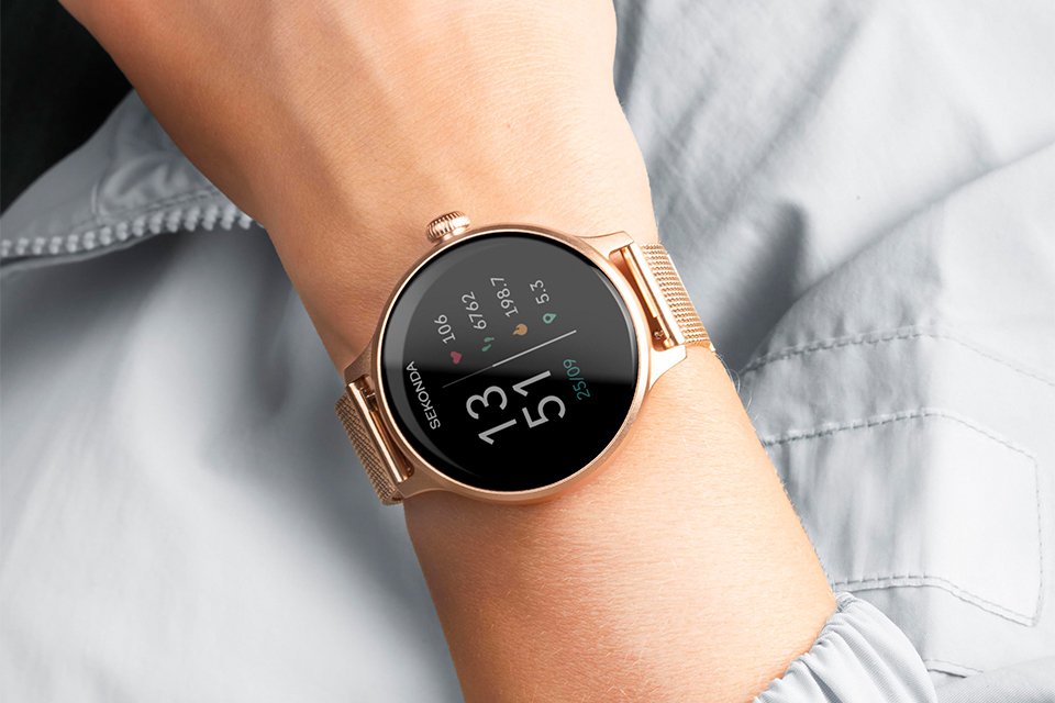 A rose gold Sekonda women's smartwatch on a wrist.