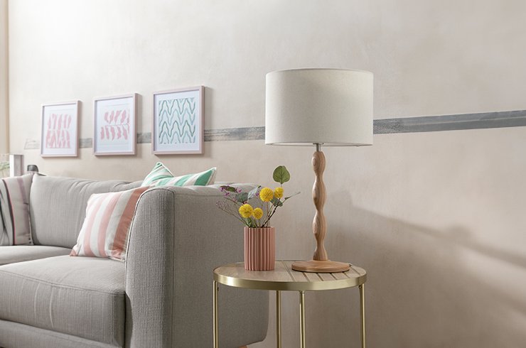 Cream lamp on wooden side table.