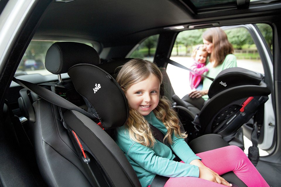An ISOFIX car seat with a top tether.