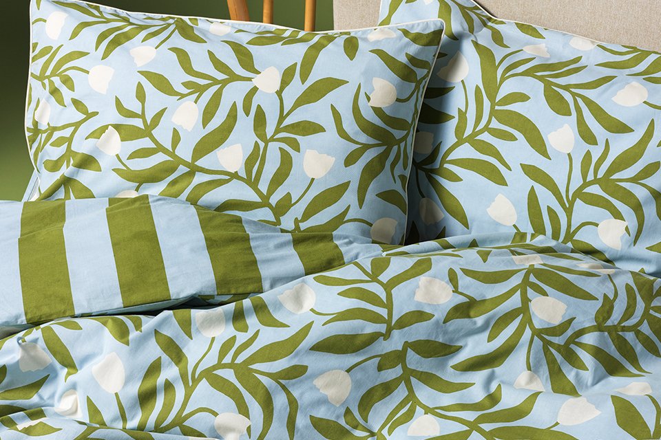 Green and blue stripe and floral pattern bedding 