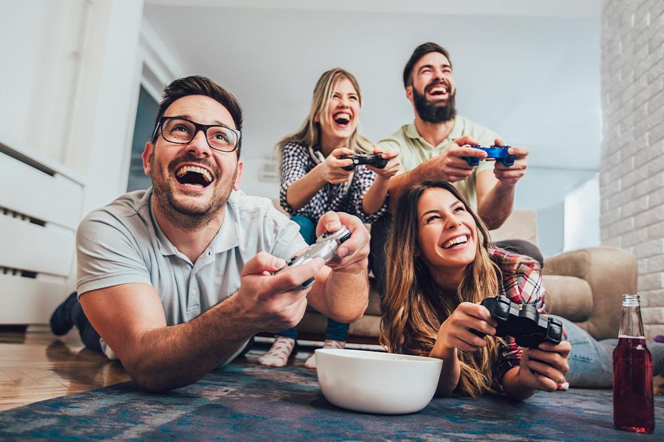 A group of friends enjoy video games.