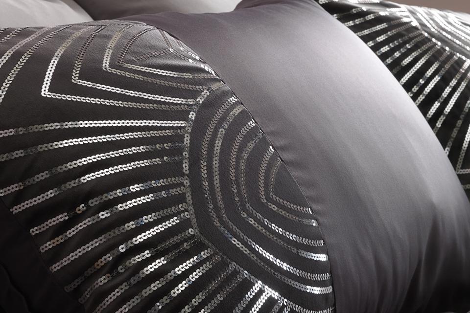 A slate coloured bedding set with sequin.