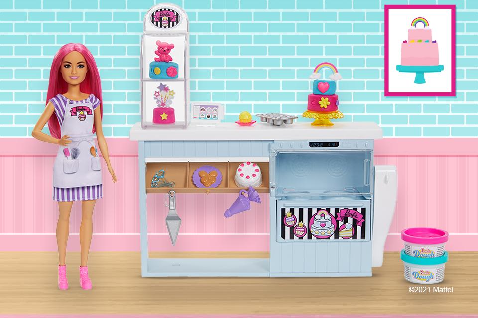 A Barbie doll dressed as a baker, with a complete bakery playset.