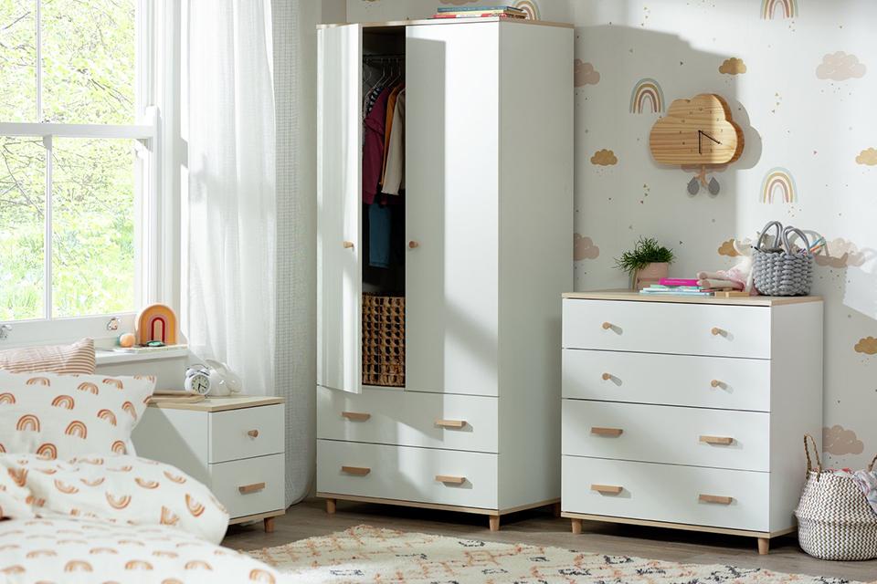 A Habitat Kids Melby 3 piece 2-door wardrobe set, bedside and chest of drawers in a kids bedroom.