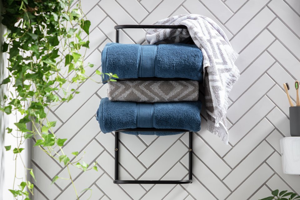 3 Towels on a Habitat Matte Black Wall Mountable Towel Holder.