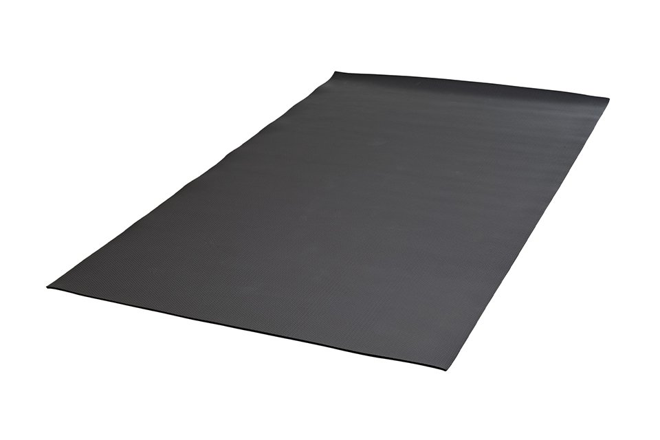 A large black exercise equipment mat.