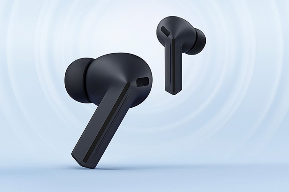 A pair of black Samsung Galaxy Buds3 FE displayed against a bluish white background. 