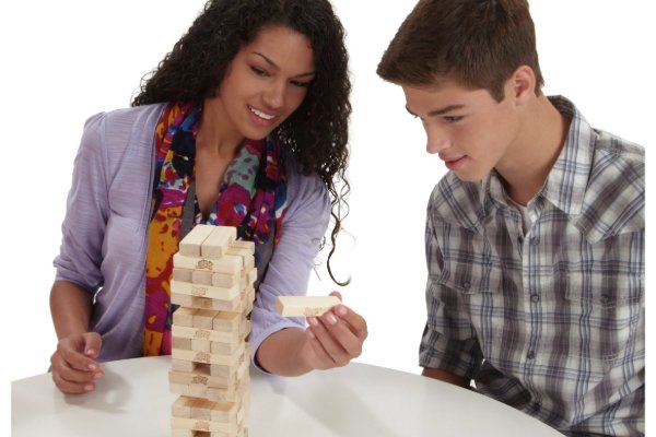 Two people playing Jenga.