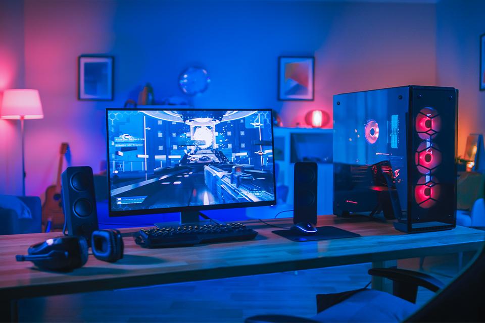 Gaming desktop PC set up in bedroom.