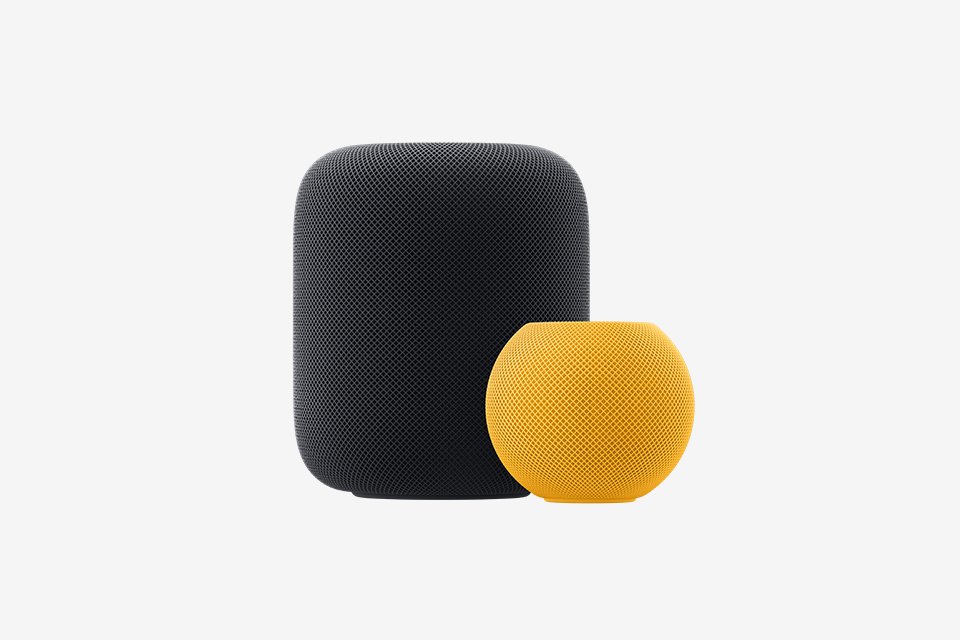A black Apple HomePod smart speaker stood next to a yellow Apple HomePod Mini smart speaker.