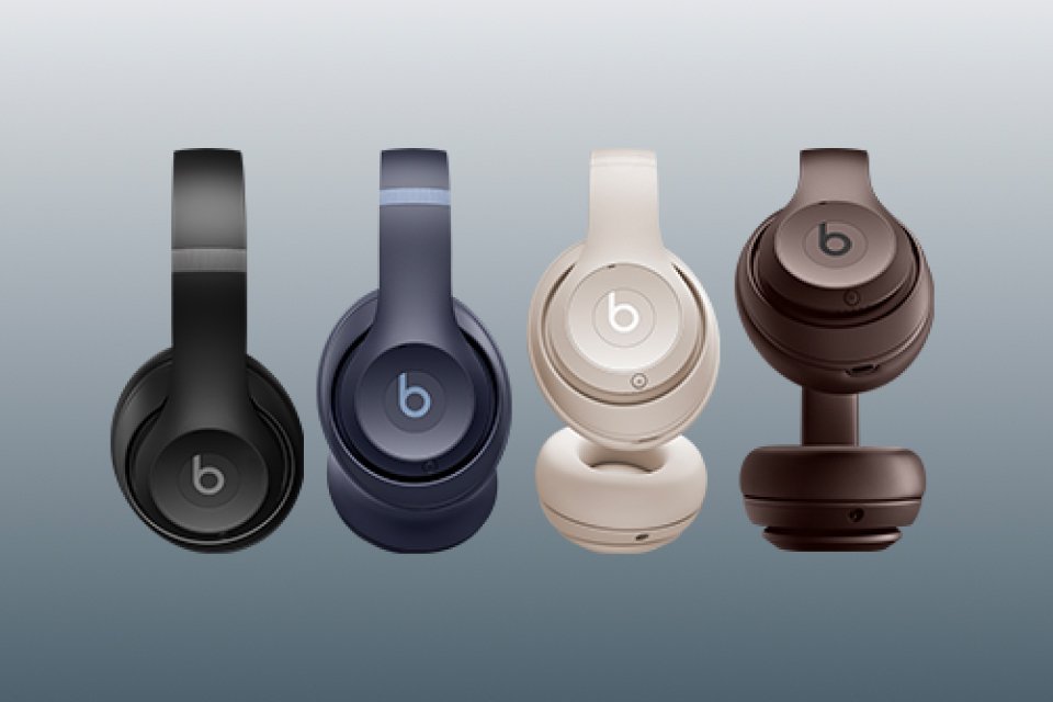 Four Beats Studio Pro headphones in black, navy, sandstone, and deep brown.