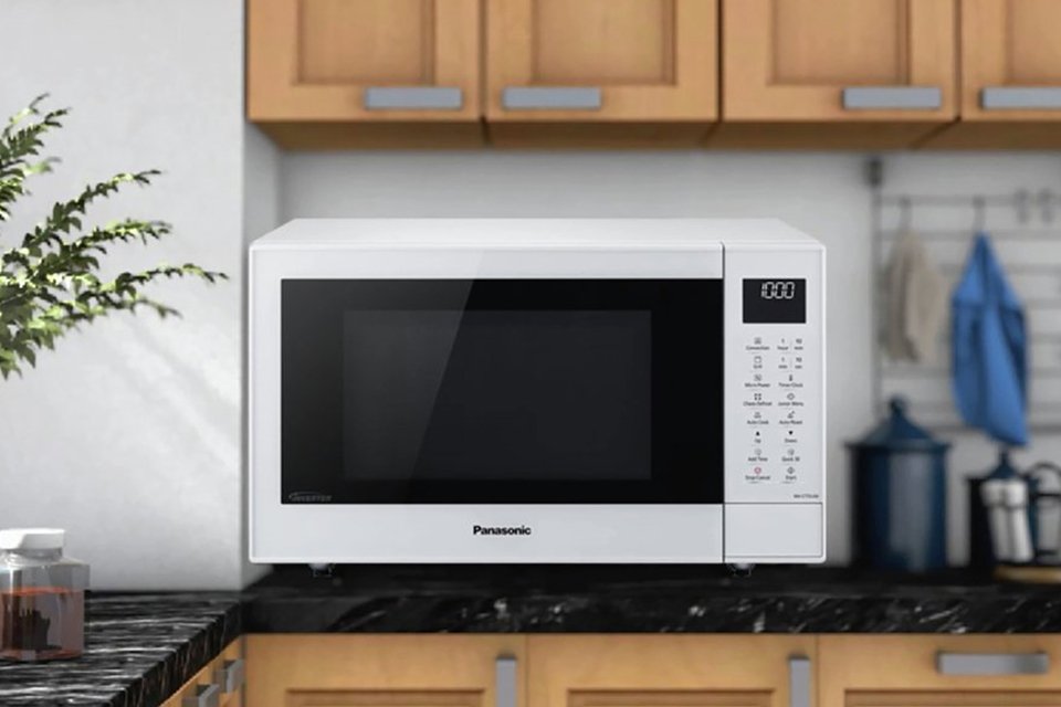 A Panasonic microwave placed on a kitchen counter.