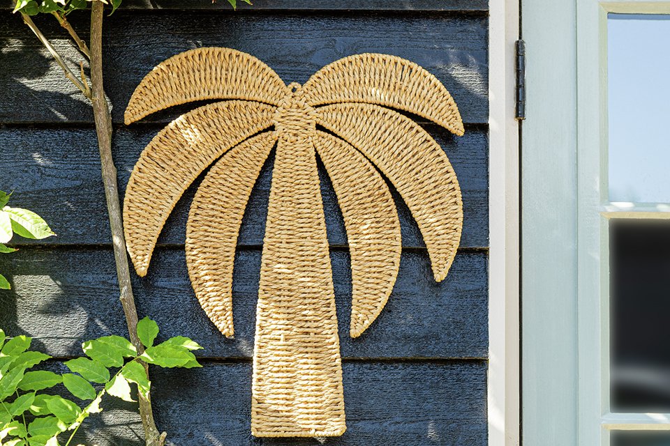 A Habitat Palm Tree iron plaque wall art.A Habitat Palm Tree iron plaque wall art.