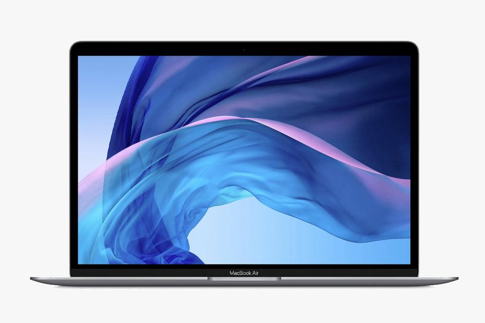 MacBook showing Apple screensaver on screen.