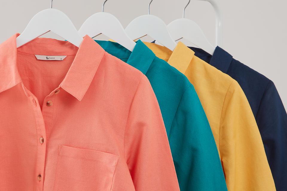 Rail of colourful women's linen shirts.