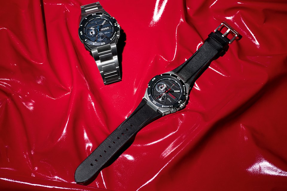 A Hugo black leather strap watch and a Hugo stainless steel bracelet watch with blue dial. 