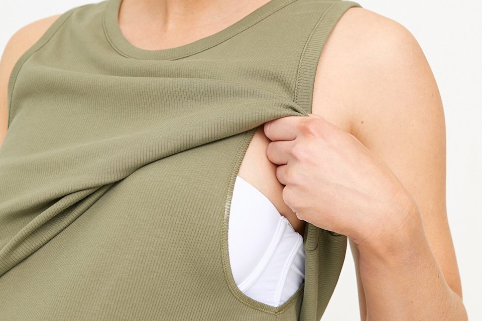 A woman in a nursing t-shirt.