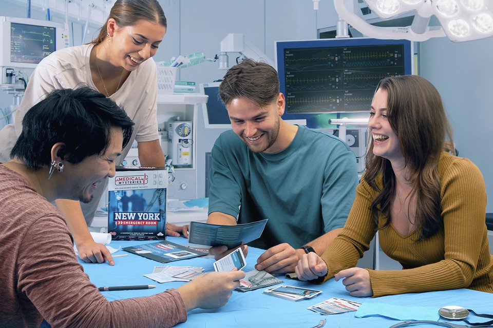 A group of friends playing Tomy Medical Mysteries Board Game.