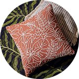 A Habitat Crewel foliage outline cushion in orange.
