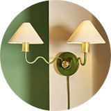 A Habitat Wiggle metal 2 light wall light on a living room wall.