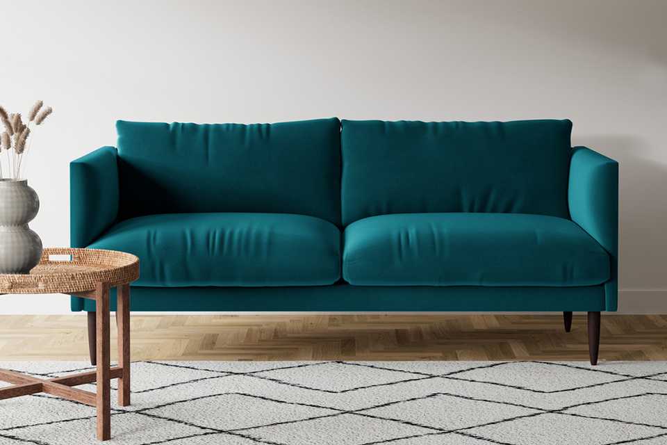 Velvet 3 seater sofa in kingfisher blue colour.