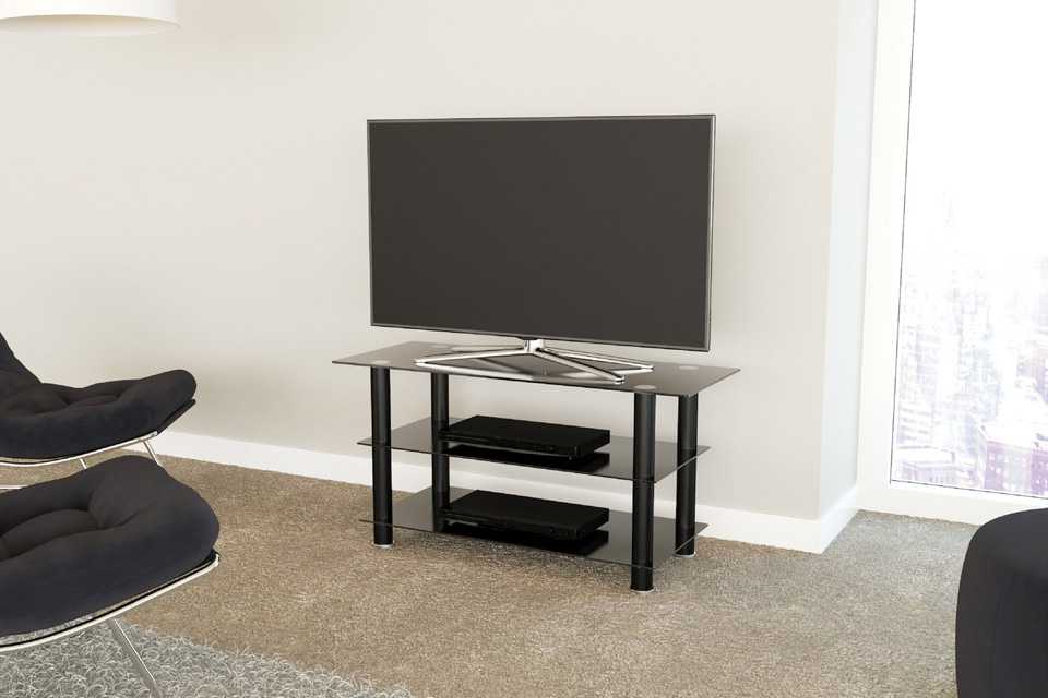 AVF glass TV stand sitting in a living room.