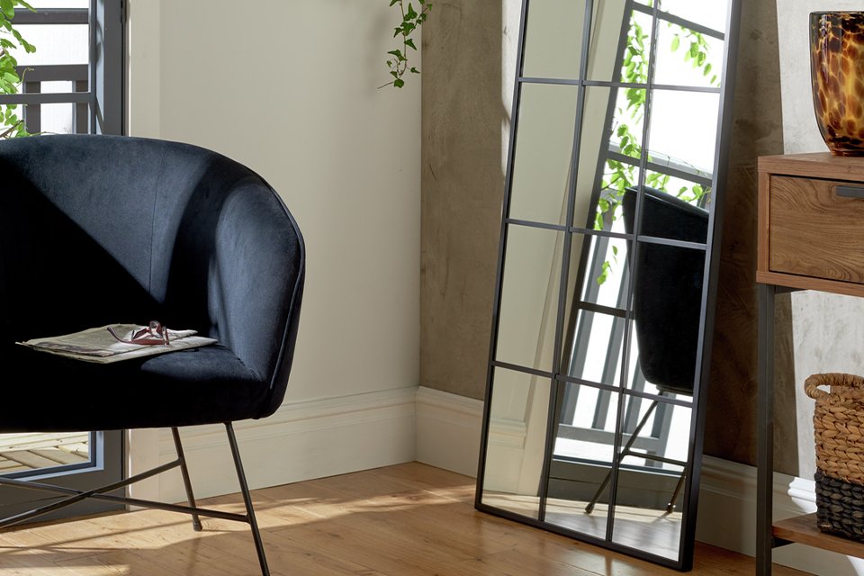 Full length mirror with black frame.