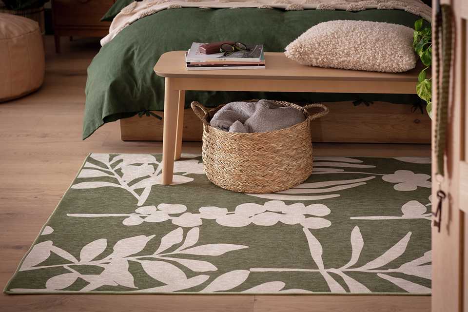 Habitat floral print flatweave rug in green and white.