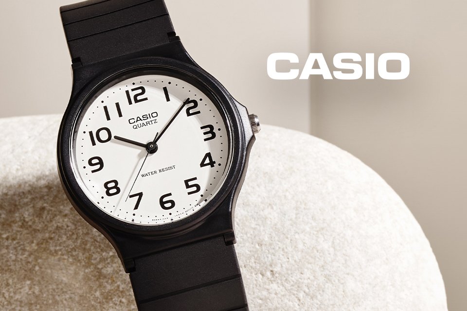 A Casio unisex black resin strap watch with white dial.