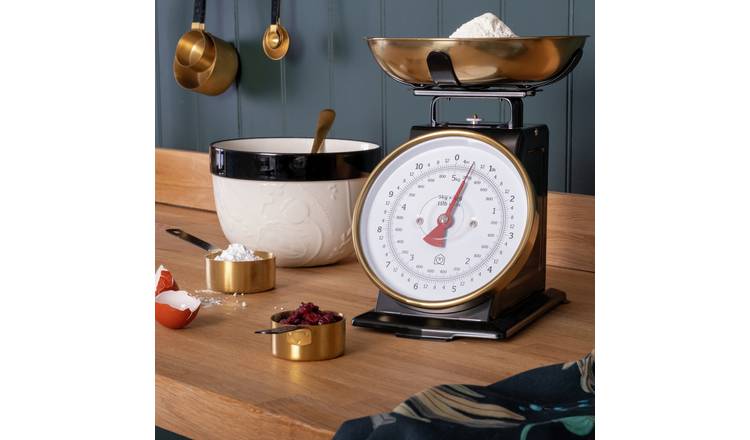 Premium Photo  Mechanical kitchen scales on wooden background